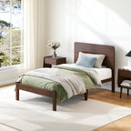 Queen size walnut bed frame styled in a mid century modern bedroom