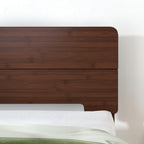 Twin dark walnut bed frame featuring a sleek solid wood headboard