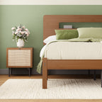 Close-up of built-in storage shelf on walnut finish wooden bed frame headboard