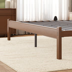 Guest room setup with a twin walnut bed frame with built-in headboard shelf