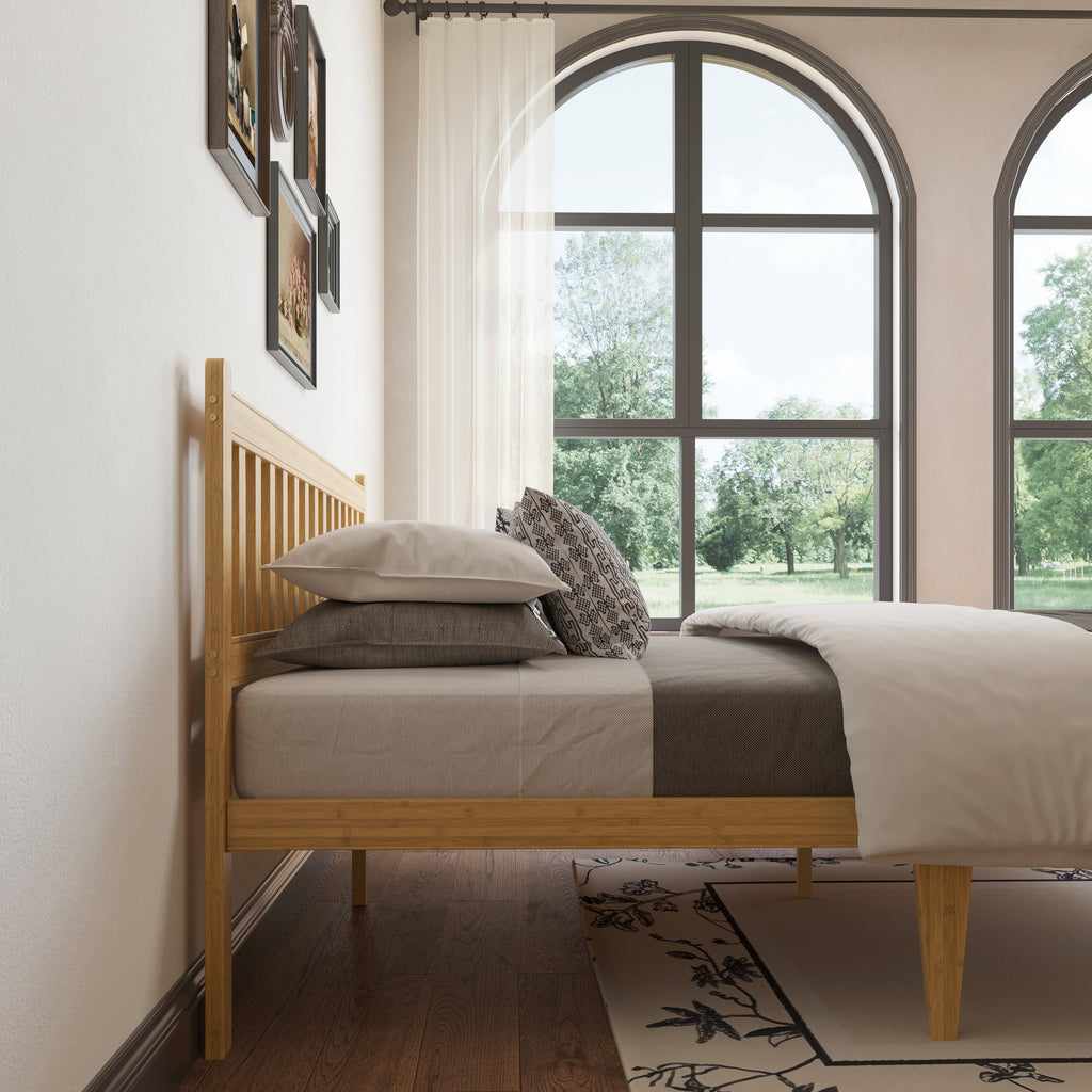 Japandi style bedroom with a queen light bamboo platform bed frame in sunlit room
