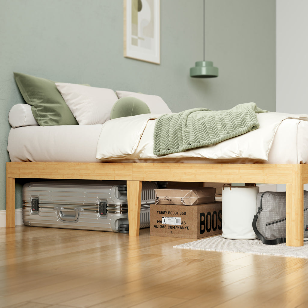 Queen size headboardless bed frame arranged in a sunlit bedroom